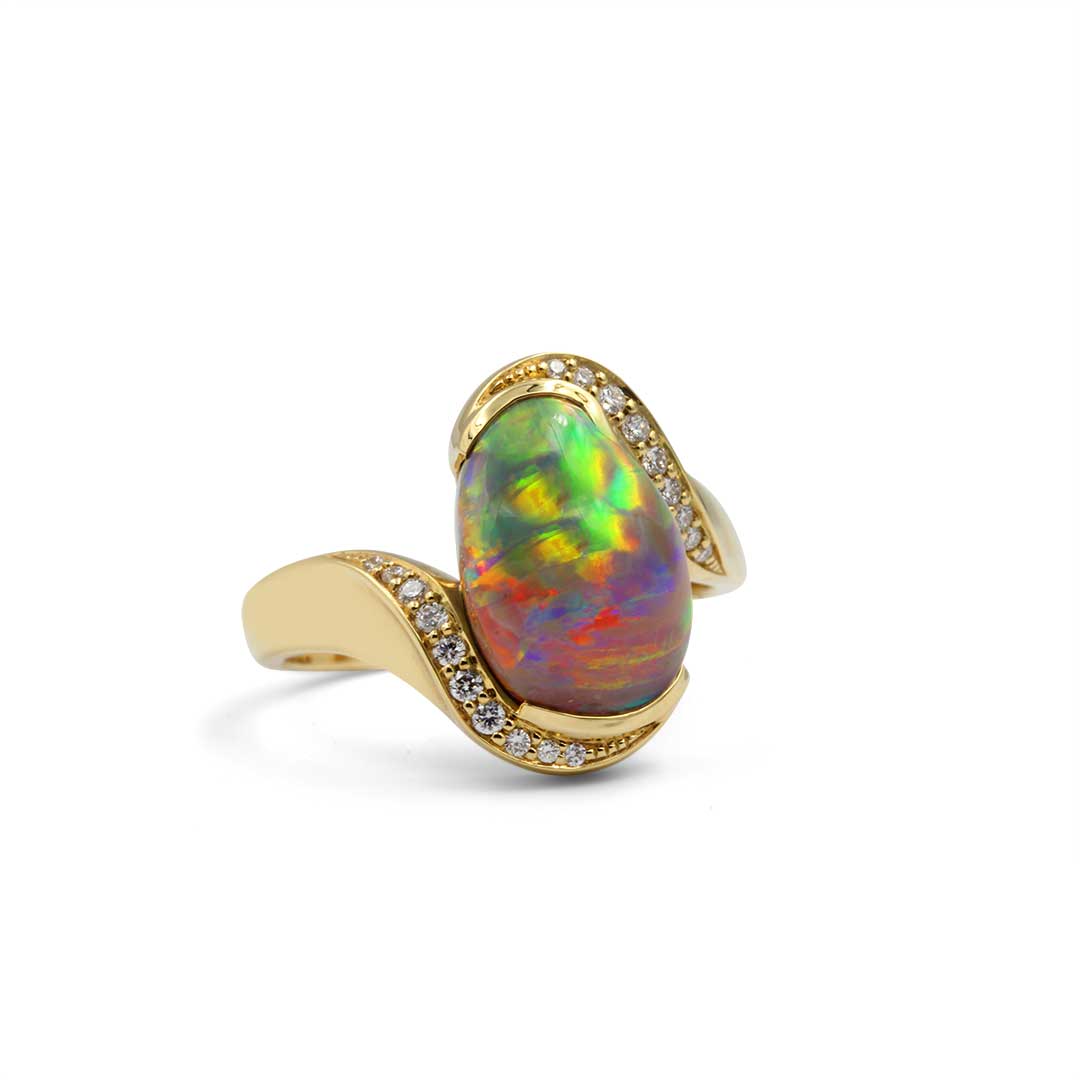 Black Opal Ring set in 18k Yellow Gold with Diamonds displaying Rolling Flashes of Red, Green and Orange
