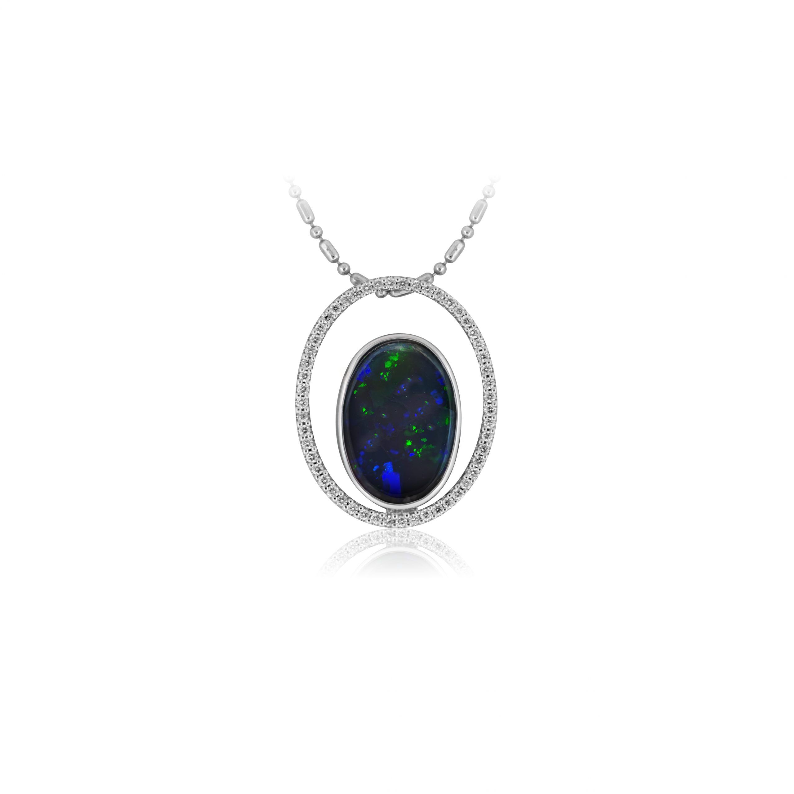 Black Opal Pendant set in 18k White Gold with Diamonds displaying a Burst of Vivid Greens and Blues